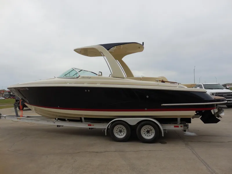 Slide: The Image of 2019 Chris-Craft Launch 28 GT boat on a trailer, side view. - 6