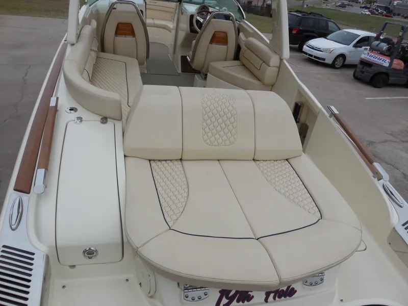 Slide: The Image of 2019 Chris-Craft Launch 28 GT boat with luxurious beige seating and elegant design. - 8