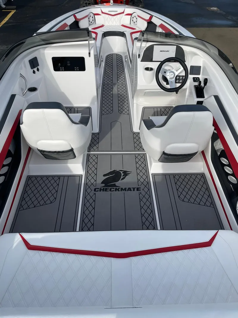 Slide: The Image of 2025 Checkmate Pulsare 2400 BRX boat interior with modern design and sleek seating. - 10