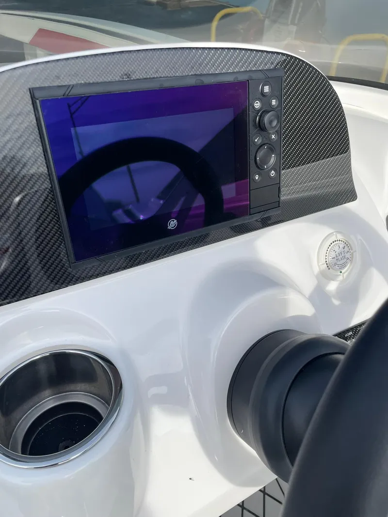 Slide: The Image of 2025 Checkmate Pulsare 2400 BRX dashboard with modern controls and display screen. - 12