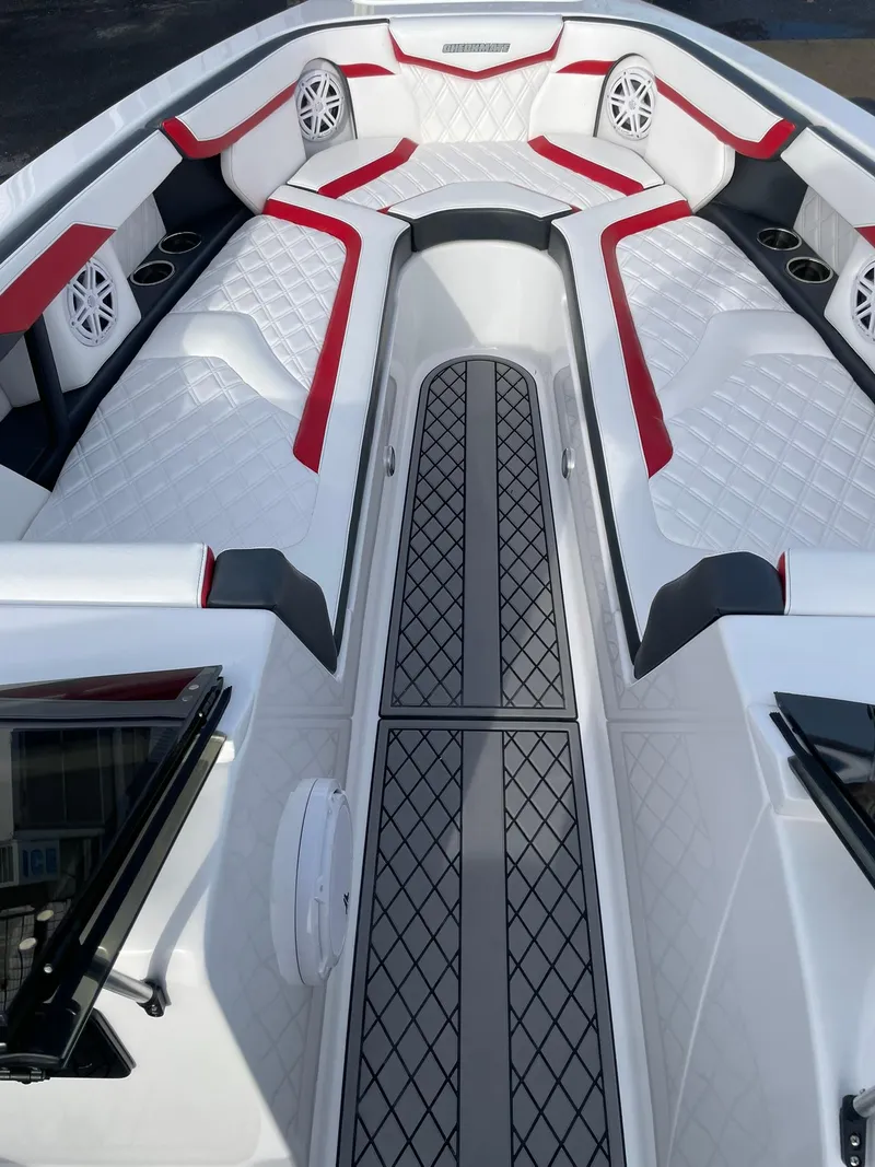 Slide: The Image of 2025 Checkmate Pulsare 2400 BRX boat interior with red and white seating and modern design. - 15
