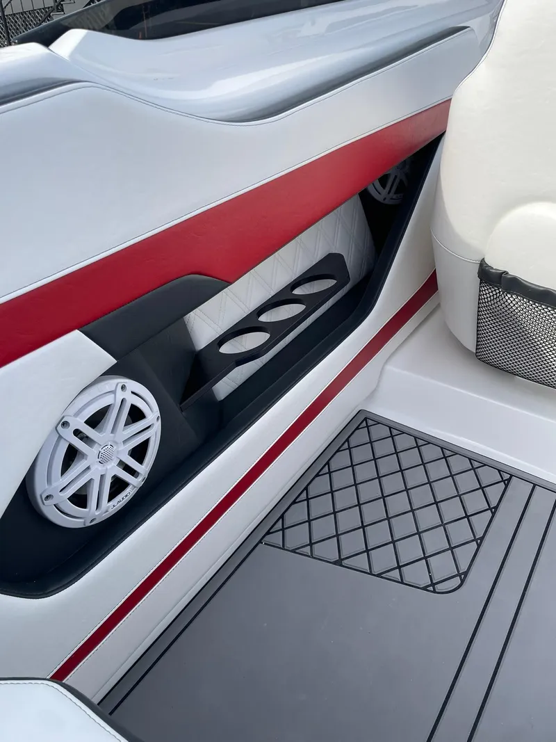 Slide: The Image of 2025 Checkmate Pulsare 2400 BRX interior with red accents and speaker detail. - 23