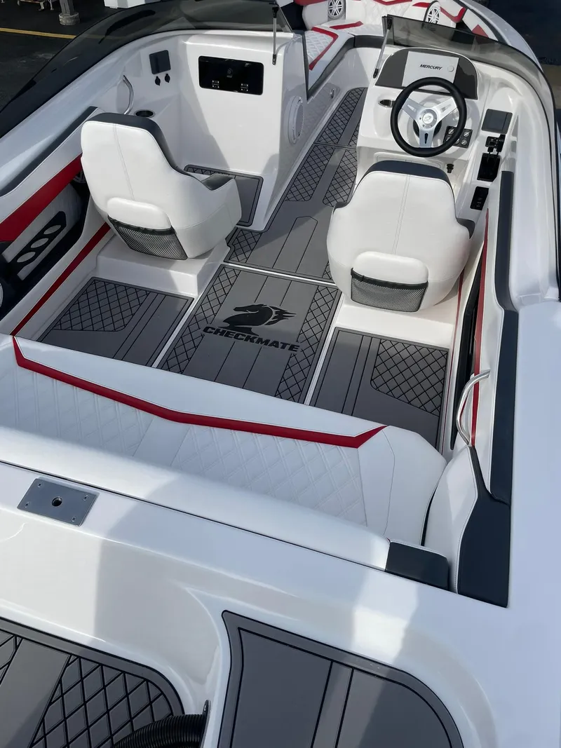 Slide: The Image of 2025 Checkmate Pulsare 2400 BRX boat interior with modern seating and sleek design. - 8