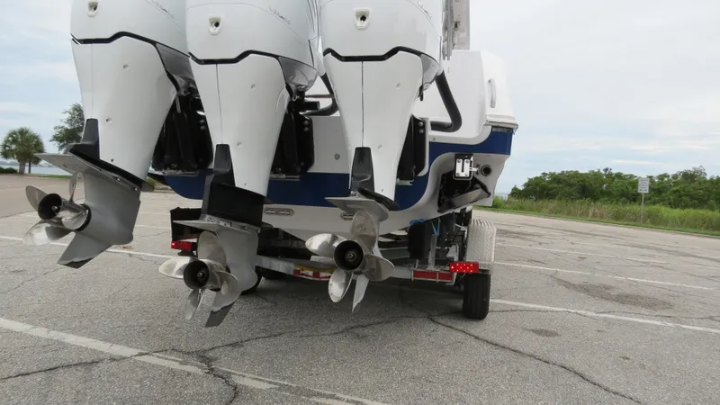 Slide: The Image of 2009 Donzi 38 ZF Open boat with triple outboard engines on trailer. - 21