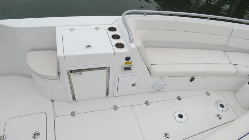 Slide: The Image of 2009 Donzi 38 ZF Open boat interior with seating and storage compartments. - 25