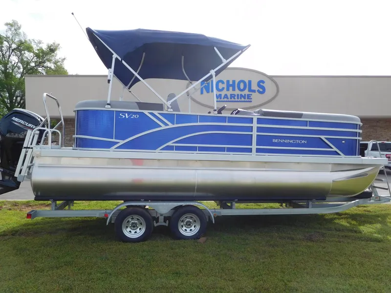 Slide: The Image of 2024 Bennington 20 SVSR pontoon boat on trailer at Nichols Marine. - 0