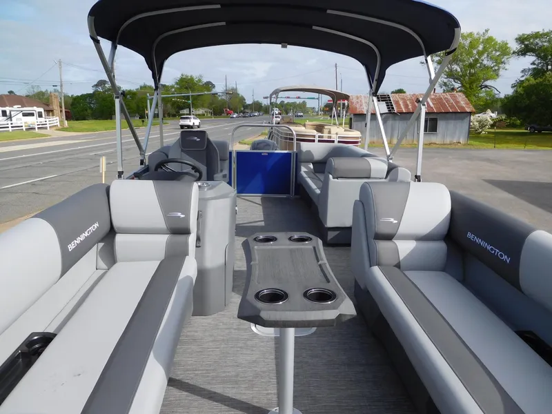 Slide: The Image of 2024 Bennington 20 SVSR pontoon boat with spacious seating and canopy. - 4