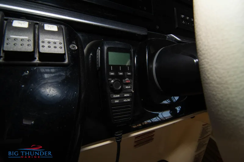 Slide: The Image of 2024 Invictus GT370S dashboard with marine radio and controls. - 34