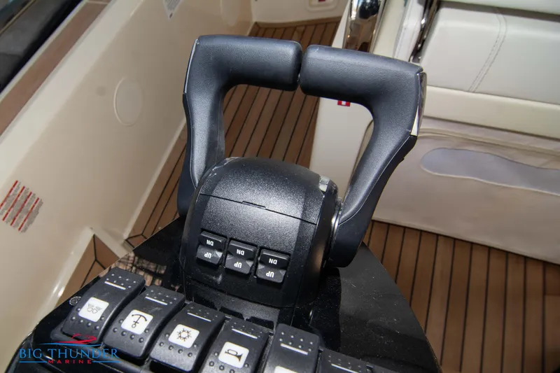 Slide: The Image of Invictus GT370S 2024 boat throttle control and dashboard buttons. - 38