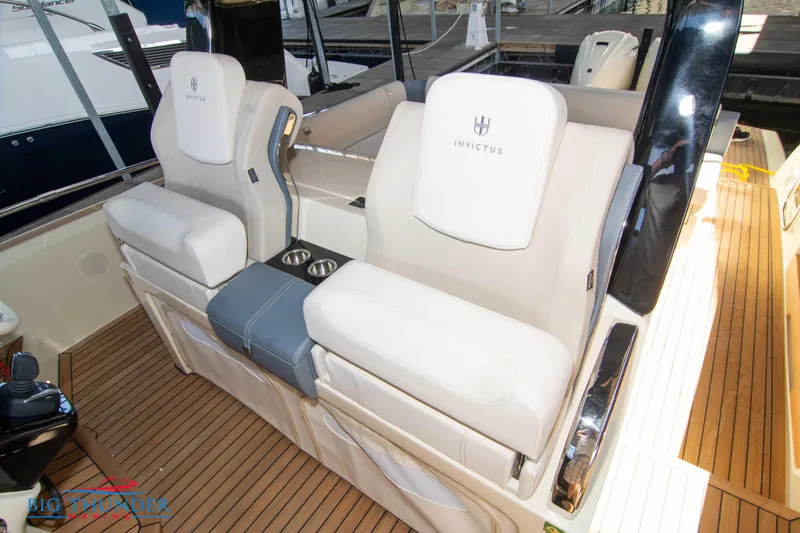 Slide: The Image of 2024 Invictus GT370S boat interior with luxurious seating and teak flooring. - 39