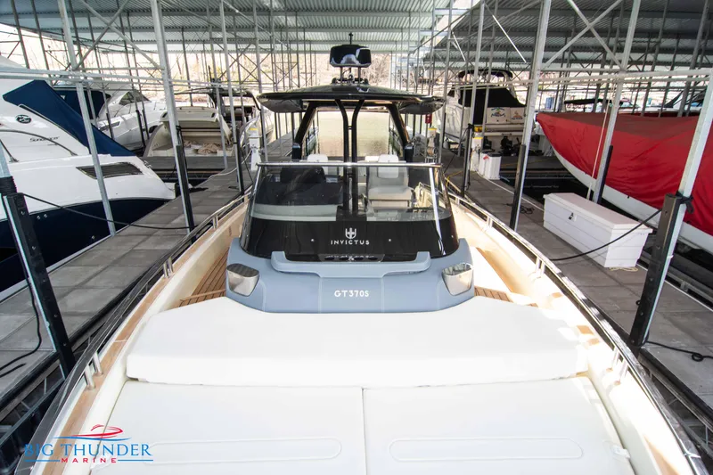 Slide: The Image of 2024 Invictus GT370S luxury yacht docked in a marina. - 47