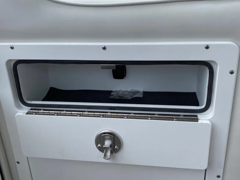 Slide: The Image of 2024 JC Neptoon Sport 23TT DSL storage compartment with lock. - 12