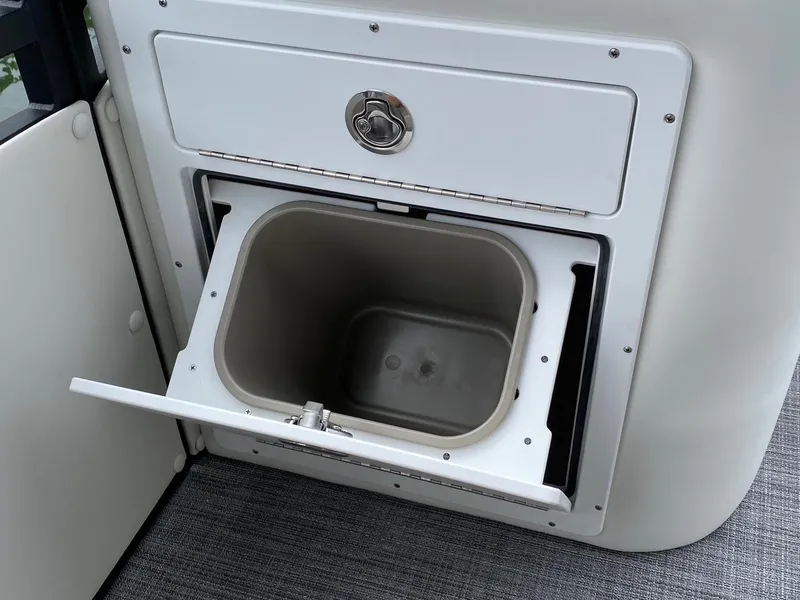 Slide: The Image of Built-in storage compartment on the 2024 JC Neptoon Sport 23TT DSL boat. - 13