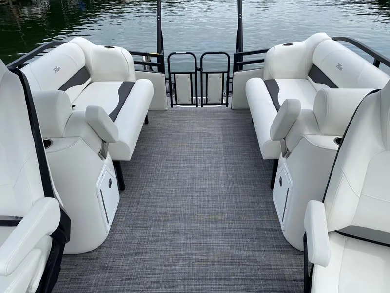 Slide: The Image of 2024 JC Neptoon Sport 23TT DSL pontoon boat interior with white seating. - 21