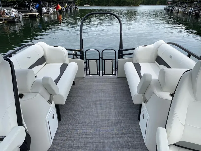Slide: The Image of 2024 JC Neptoon Sport 23TT DSL pontoon boat interior with white seating. - 22