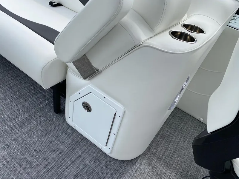 Slide: The Image of 2024 JC Neptoon Sport 23TT DSL boat interior with white seating and cup holders. - 23