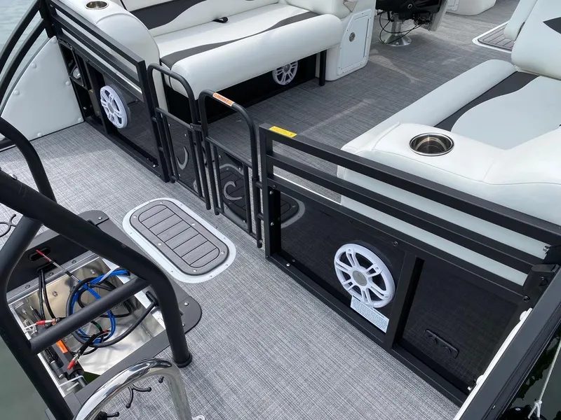 Slide: The Image of 2024 JC Neptoon Sport 23TT DSL pontoon boat interior with seating and speakers. - 26