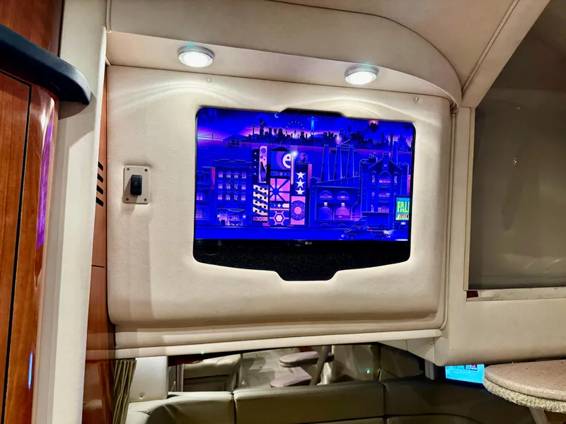 Slide: The Image of Interior of 2007 Sea Ray 320 Sundancer with illuminated TV screen. - 14