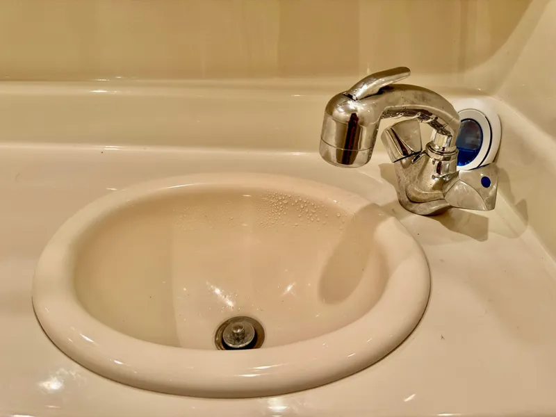 Slide: The Image of Bathroom sink with chrome faucet on 2007 Sea Ray 320 Sundancer yacht. - 15