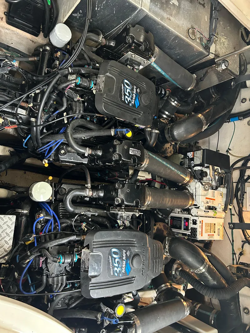 Slide: The Image of 2007 Sea Ray 320 Sundancer boat interior with white cushioned seating. - 23