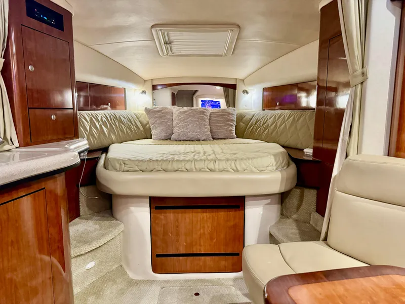 Slide: The Image of Luxurious interior of 2007 Sea Ray 320 Sundancer yacht with cozy bed and elegant wood finishes. - 7