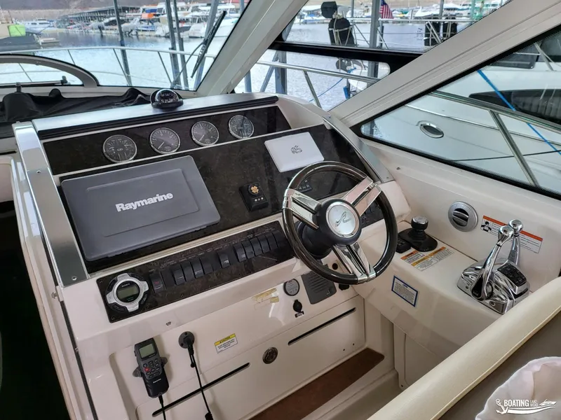 Slide: The Image of Helm of 2012 Sea Ray 450 Sundancer with Raymarine electronics and modern controls. - 12
