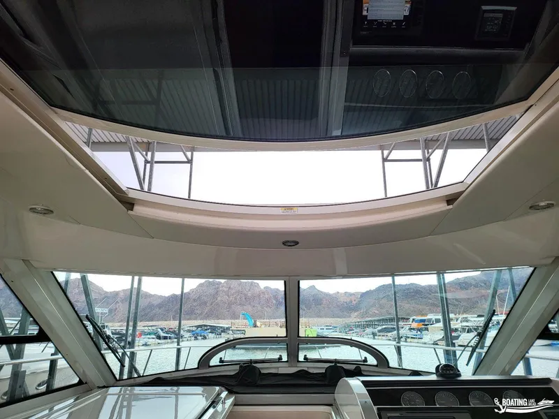 Slide: The Image of Interior view of 2012 Sea Ray 450 Sundancer yacht with panoramic windows and sunroof. - 17