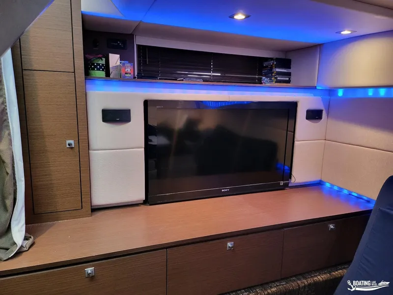 Slide: The Image of Interior of 2012 Sea Ray 450 Sundancer with TV and blue LED lighting. - 27