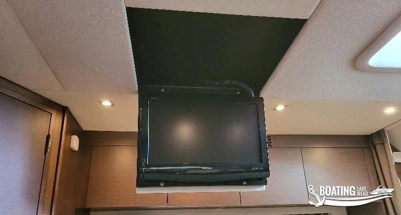 Slide: The Image of Flat-screen TV in the cabin of a 2012 Sea Ray 450 Sundancer yacht. - 28