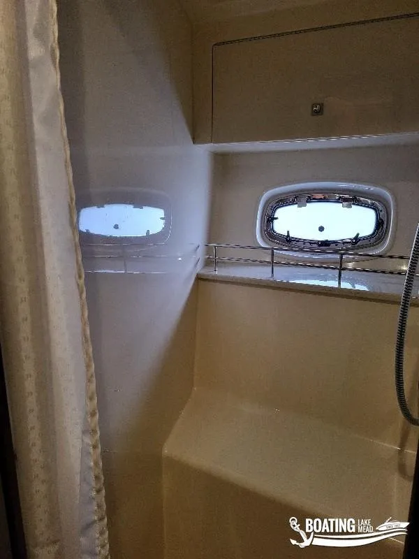 Slide: The Image of Interior shower area of 2012 Sea Ray 450 Sundancer yacht with porthole windows. - 35