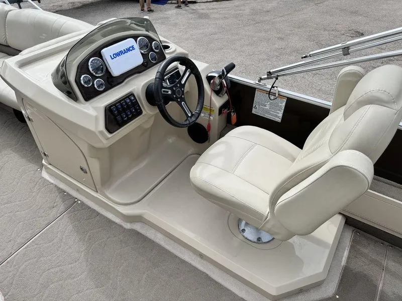 Slide: The Image of 2018 Starcraft 23 FD boat helm with Lowrance display and captain's chair. - 5