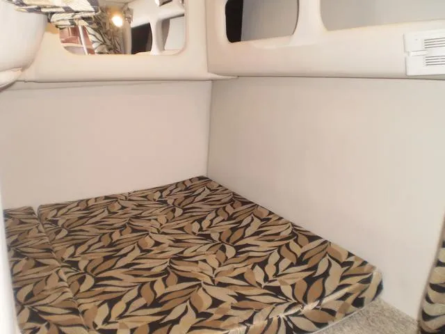 Slide: The Image of 2021 Crownline 264 CR cabin interior with patterned cushions - 34