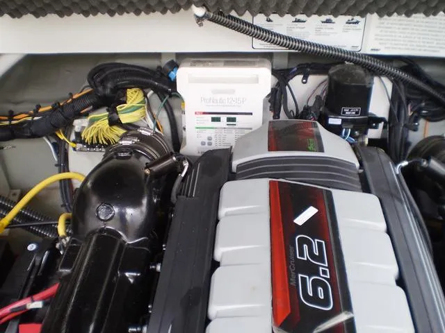 Slide: The Image of 2021 Crownline 264 CR engine compartment with 6.2L engine and ProNautic charger. - 42