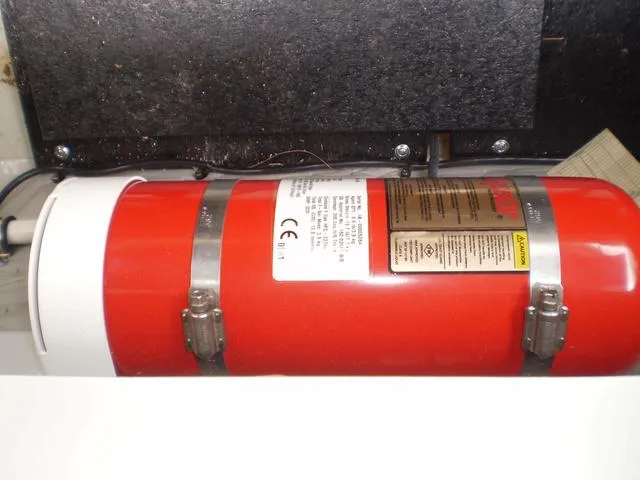 Slide: The Image of Fire extinguisher in the engine compartment of a 2021 Crownline 264 CR boat. - 44