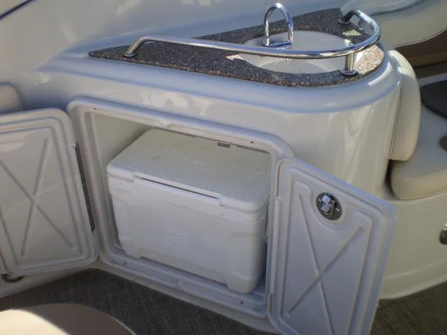 Slide: The Image of 2021 Crownline 264 CR boat with built-in cooler and sink. - 8