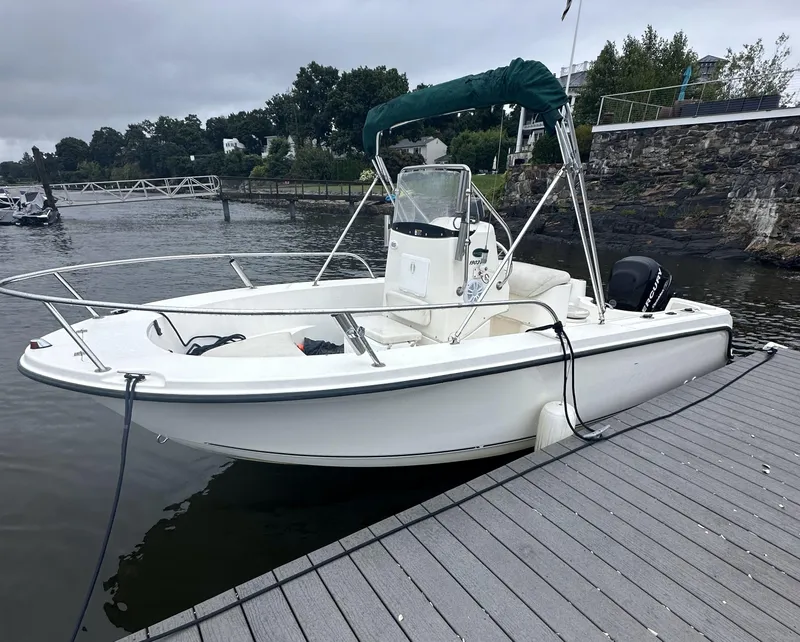 Slide: The Image of 2008 Trophy 1903 Center Console boat docked by the water. - 0
