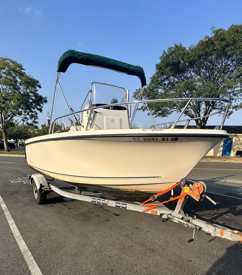 Slide: The Image of 2008 Trophy 1903 Center Console boat on trailer, parked outdoors. - 1