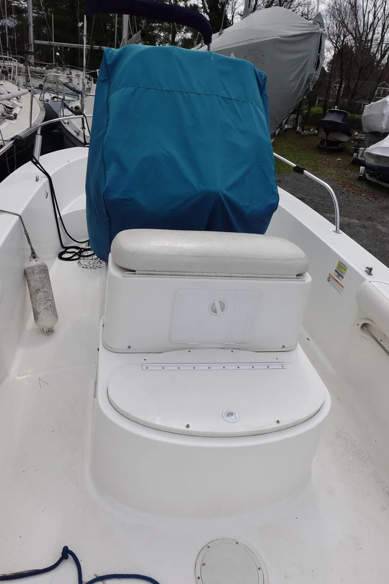 Slide: The Image of 2008 Trophy 1903 Center Console boat with blue cover and seating. - 10