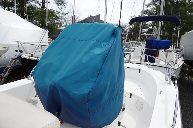 Slide: The Image of 2008 Trophy 1903 Center Console boat with blue cover in marina. - 12