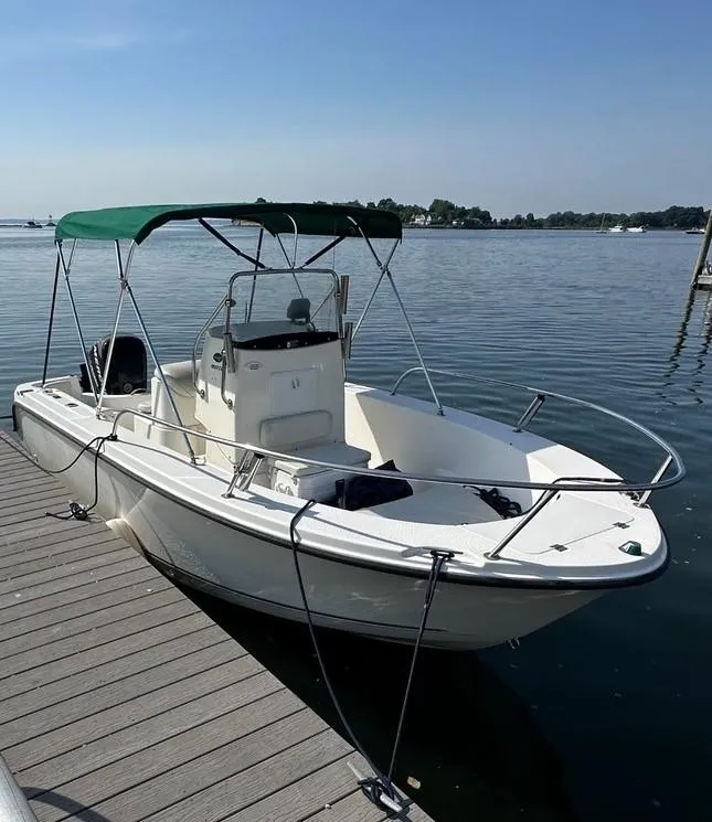 Slide: The Image of 2008 Trophy 1903 Center Console boat docked on calm water. - 4