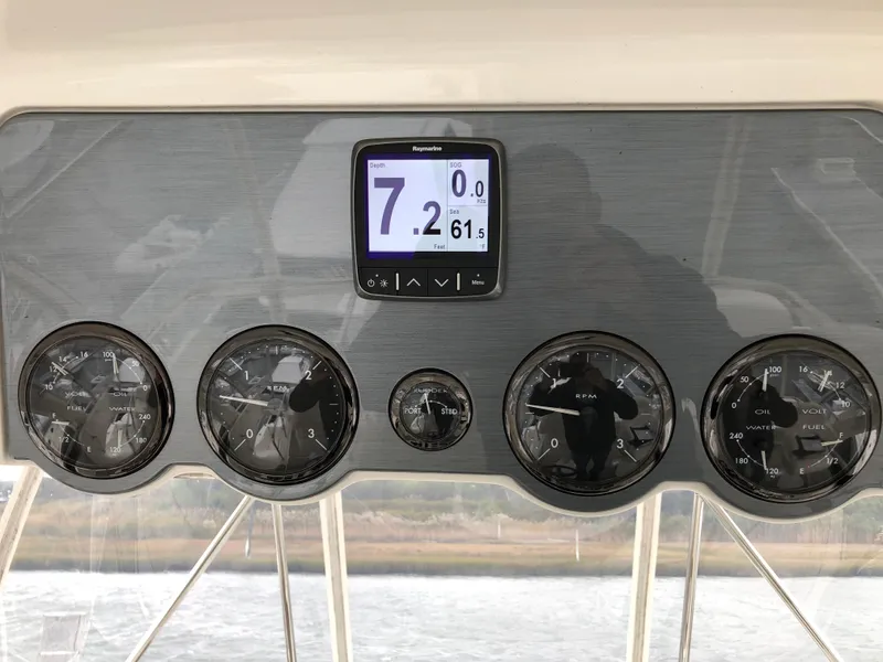 Slide: The Image of Instrument panel of a 2006 Sea Ray 52 Sedan Bridge yacht. - 12