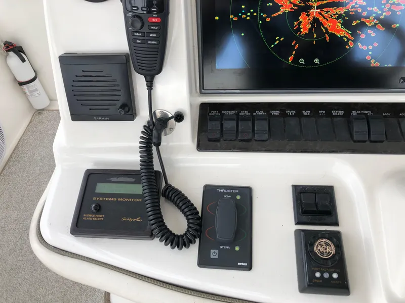 Slide: The Image of 2006 Sea Ray 52 Sedan Bridge helm controls and navigation equipment. - 15