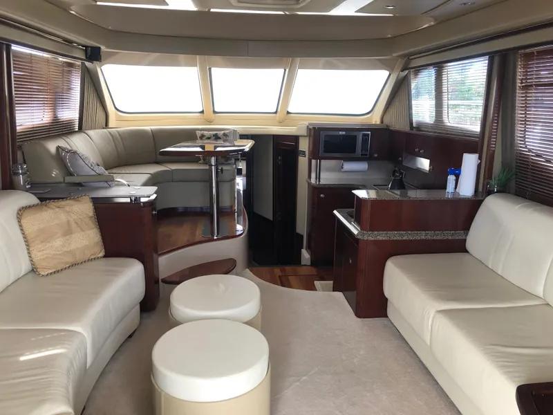 Slide: The Image of Luxurious interior of 2006 Sea Ray 52 Sedan Bridge yacht with leather seating and modern amenities. - 17