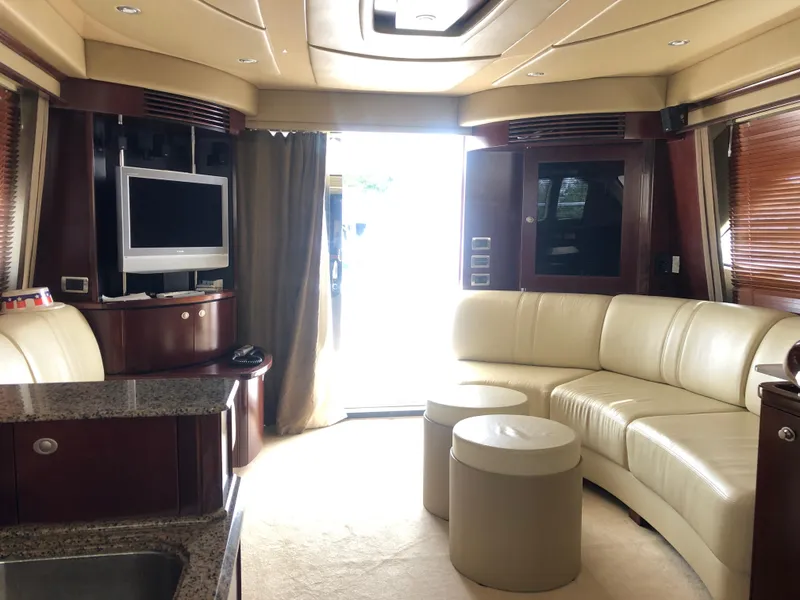 Slide: The Image of Luxurious interior of 2006 Sea Ray 52 Sedan Bridge yacht with leather seating and entertainment system. - 18