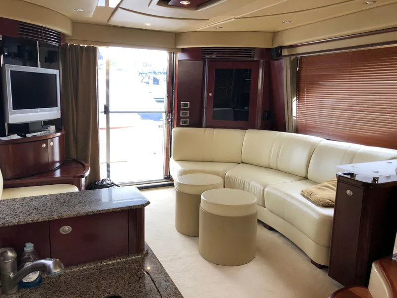Slide: The Image of Luxurious interior of 2006 Sea Ray 52 Sedan Bridge yacht with leather seating and modern amenities. - 19