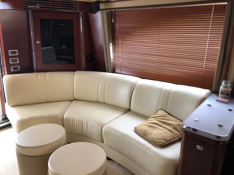 Slide: The Image of Luxurious interior of a 2006 Sea Ray 52 Sedan Bridge yacht with cream leather seating. - 23