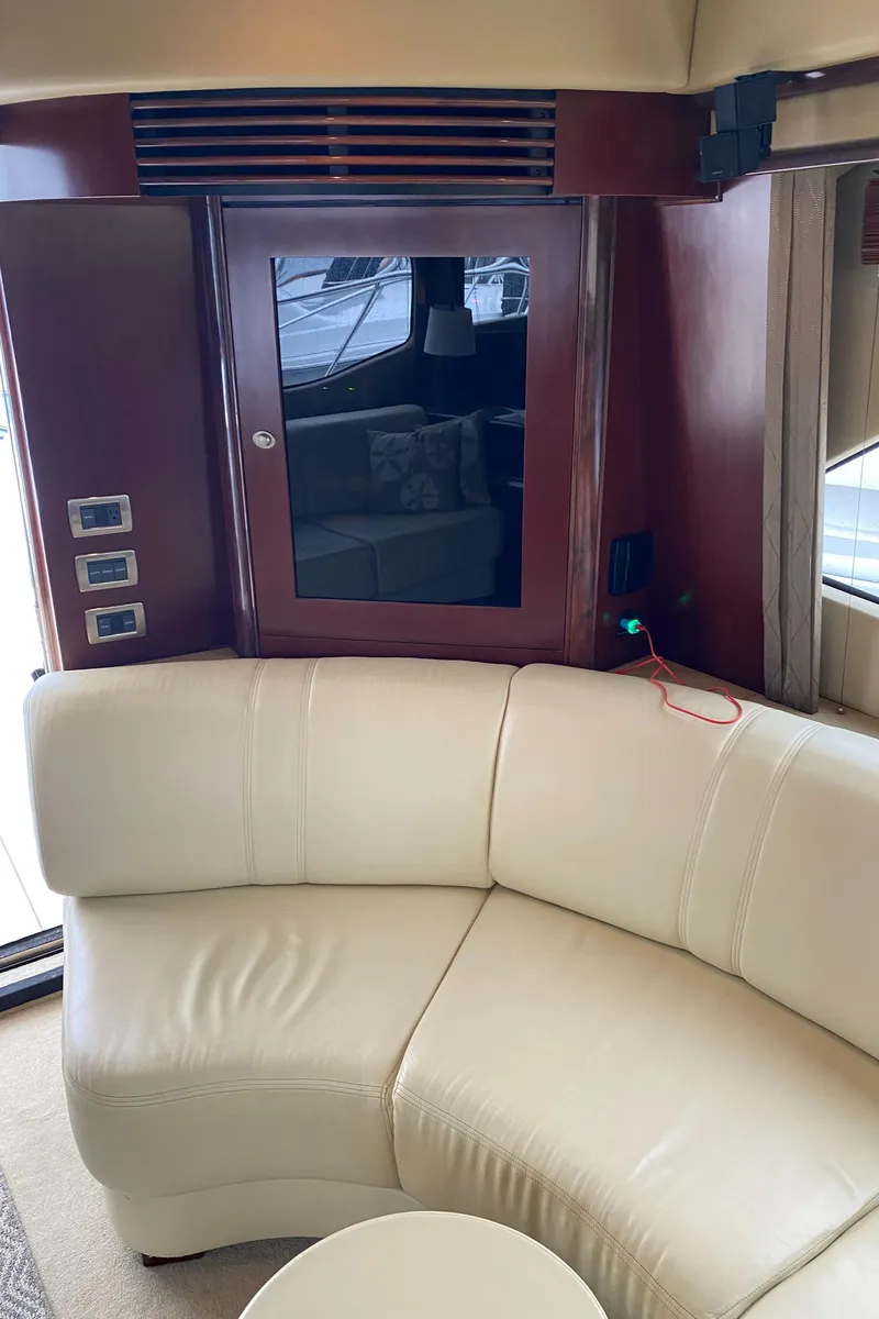 Slide: The Image of Interior of 2006 Sea Ray 52 Sedan Bridge with cream leather seating. - 24