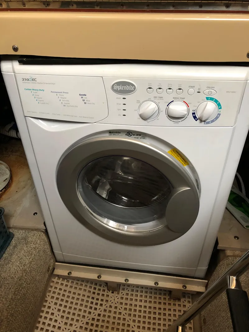 Slide: The Image of Washing machine inside a 2006 Sea Ray 52 Sedan Bridge yacht. - 28