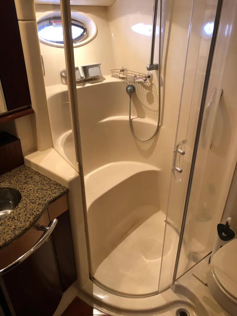 Slide: The Image of 2006 Sea Ray 52 Sedan Bridge yacht bathroom with shower and granite countertop. - 36