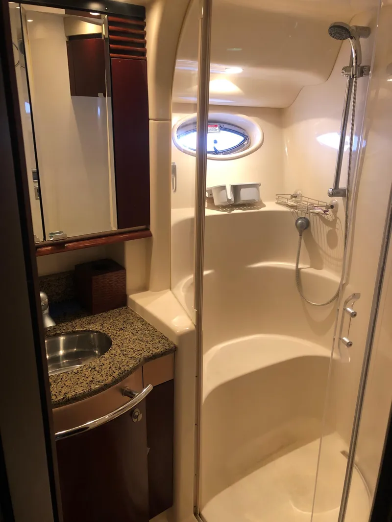 Slide: The Image of 2006 Sea Ray 52 Sedan Bridge bathroom with shower and sink. - 37